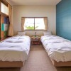 石垣市出售中的整棟旅館/民宿/酒店房地產 西式寢室